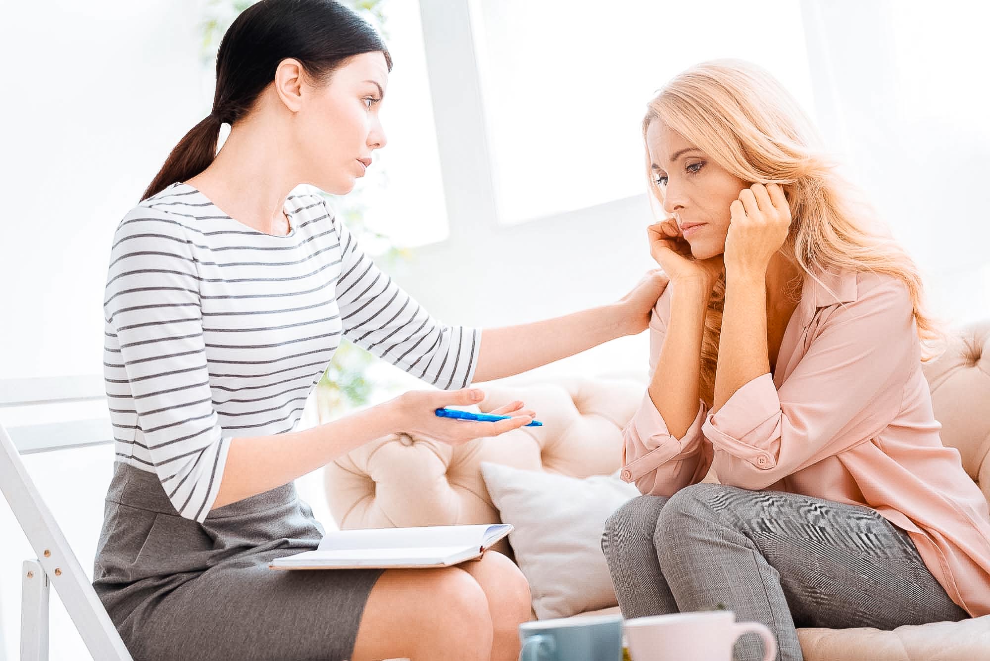 Upset thoughtful woman holding her chin