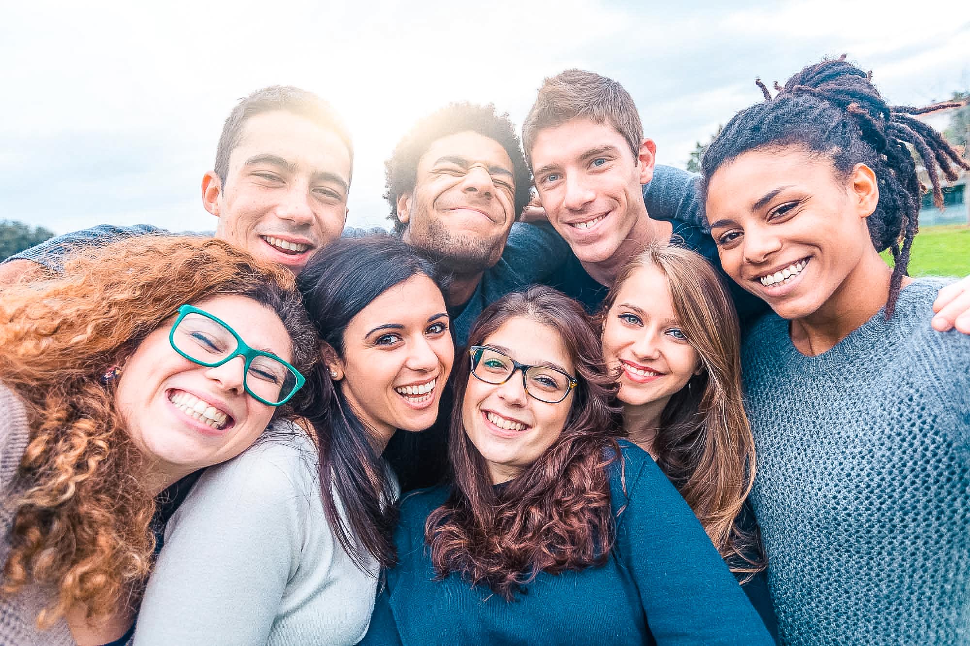 Multiracial people together in a selfie making funny faces - Gro